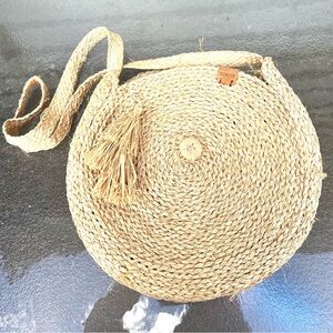 BORNE Round woven straw / seagrass crossbody or shoulder bag with Tassles